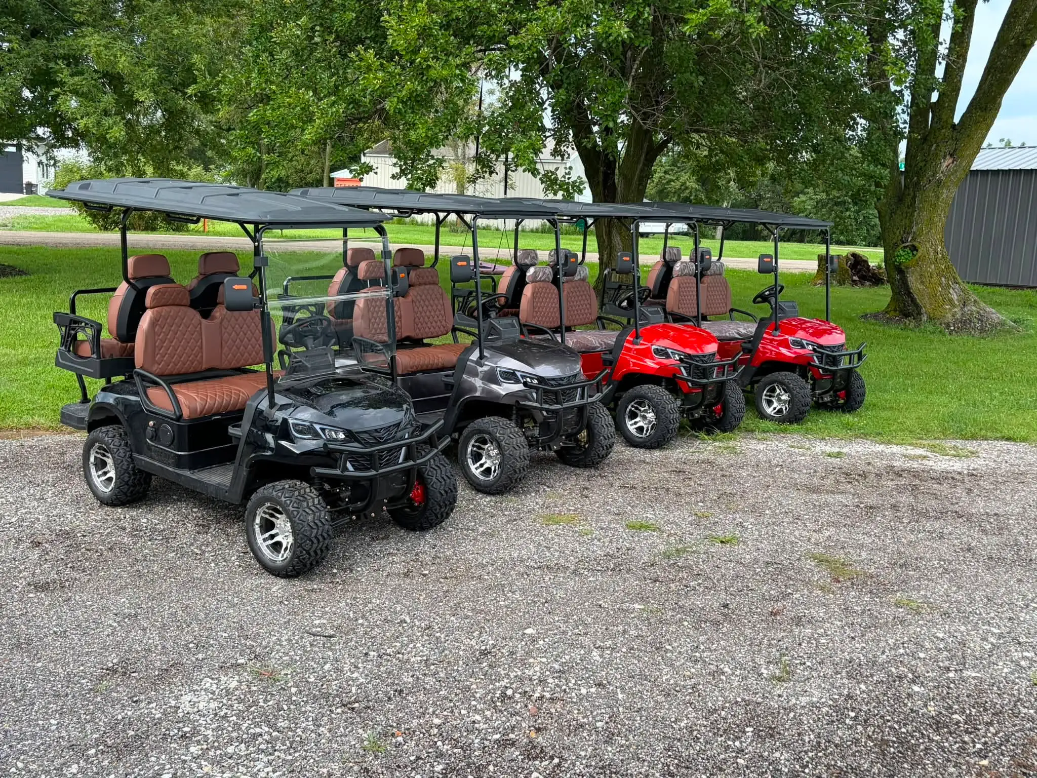 Black and red 4-seater luxury electric golf carts with leather seats ready for rental in Ottawa