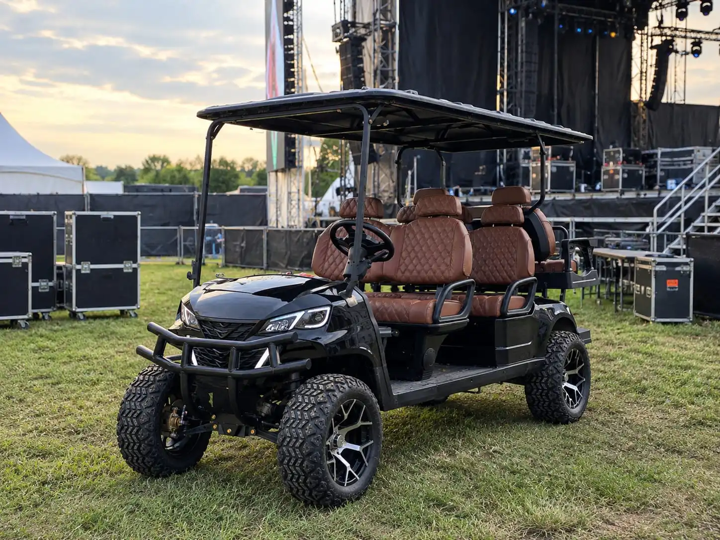 Luxury 6-seater electric golf cart rental parked backstage at an Ottawa concert